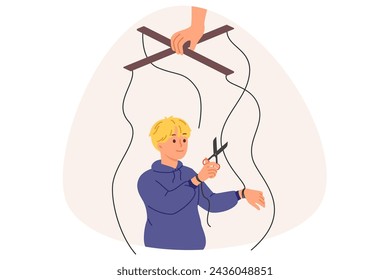 Independent boy frees himself from parental manipulation by cutting puppeteer ropes that interfere with self-development. Puppeteer hand is trying to control child and direct son in right direction