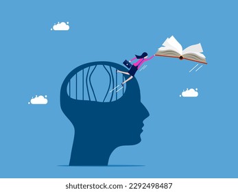 Independent with knowledge and learning. Businesswoman escapes from brain prison with book