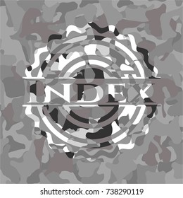 Index on grey camouflaged texture