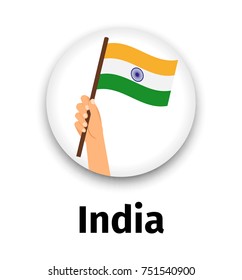 India flag in hand, round icon with shadow isolated on white. Human hand holding flag, vector illustration