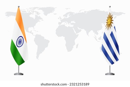 India and Uruguay flags for official meeting against background of world map.