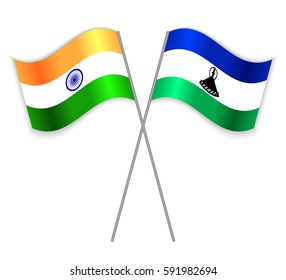 Indian and Basotho crossed flags. India combined with Lesotho isolated on white. Language learning, international business or travel concept.