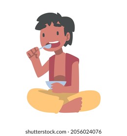 Indian Boy Character Sitting on the Floor with Bowl Having Meal Vector Illustration