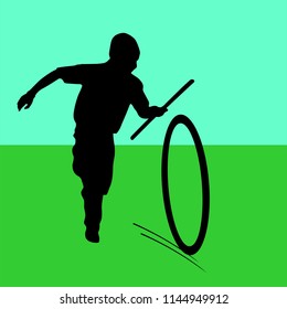 Indian boy play with a wheel 