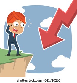 indian businessman shock see downward arrow from cliff edge