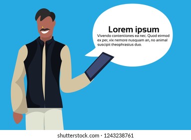 indian businessman using tablet, chat bubble communication.   National traditional male clothes cartoon character.  Horizontal copy space flat