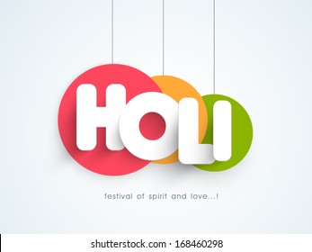 Indian color festival Holi concept with hanging stickers and stylish text on blue background. 