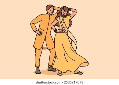 Indian couple performs ritual mating dance, moving rhythmically to oriental music. Newlyweds in indian national clothes dance while performing in front of audience at ethnic festival