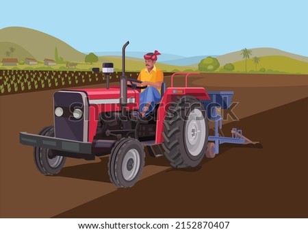 Indian farmer riding a tractor
