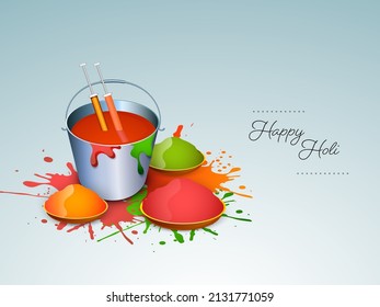 Indian festival of colours, Happy Holi concept with watercolours in basket, colourguns(pichakri), and shiny drycolours(gulal) on traditional floral background.