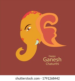 Indian festival Ganesh Chaturthi celebrated all over India orangr color Ganesha idol on light brown color background