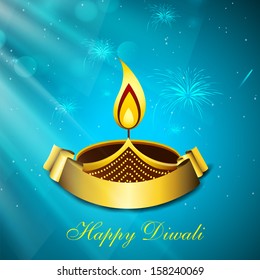 Indian festival Happy Diwali concept with illuminated oil lit lamp and golden ribbon for your messages on blue background. 