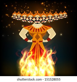 Indian festival Happy Dussehra background with statue of Ravana with his ten heads in fire. 