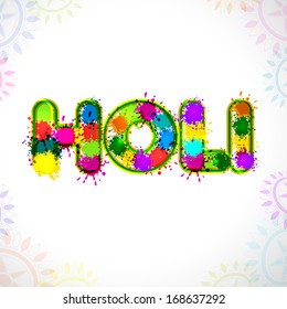 Indian festival Happy Holi celebration concept with colorful text on floral decorated grey background. 