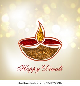 Indian festival of lights, Happy Deepawali greeting card with illuminated oil lit lamp on shiny abstract background. 