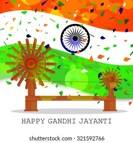 Indian Flag with confetti and charkha of Mahatma Gandhi or spinner for Independence Day, Republic Day, Gandhi Jayanti 2nd October 