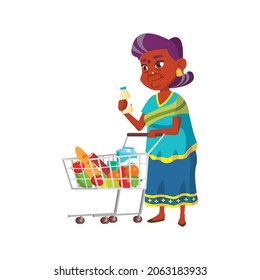 indian granny putting milk bottle in market cart cartoon vector. indian granny putting milk bottle in market cart character. isolated flat cartoon illustration