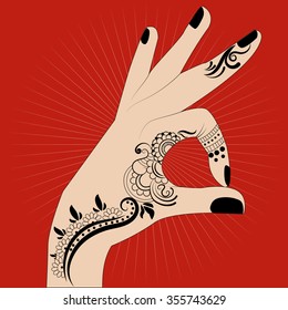 Indian hand painting with henna on a red background