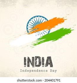 Indian Independence Day celebration with national flag colors and ashoka wheel on abstract grey background for 15th of August, Independence Day celebrations.    