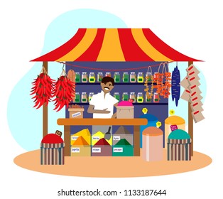 Indian man selling spices in street shop. Trade fair stall. Chili pepper, dries fruits, cinnamon. Flat vector illustration.