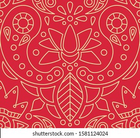 Indian seamless pattern with paisley and lotus ornament on red background