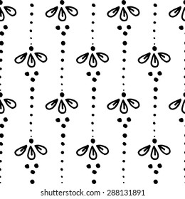 Indian style seamless pattern with black and white ethnic flowers. Background for textile or wrapping paper.