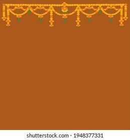 Indian Toran hanging floral decoration with red and orange marigold flowers  with green leaves on brown color background.