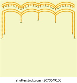 Indian traditional door hanging decoration with yellow and orange flowers with green mango leaves in arch form on light yellow color background.