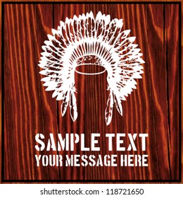 Indian war bonnet/headdress isolated on dark wooden background