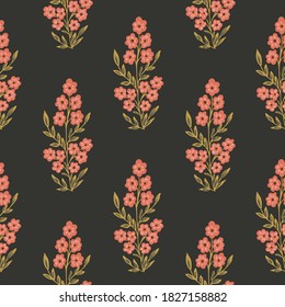 Indian wildflower motif seamless vector pattern. Little flowers a flowering tree in an Indian style. Coral and green on black . Great for home décor, fabric, wallpaper, stationery, design projects.