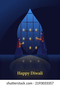 Mujer India Con Su Hija Decorando La Ventana De Lámparas De Aceite Iluminado (Diya) En Fondo Azul Para El Concepto De Celebración De Diwali.