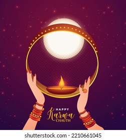 Indian woman performing Hindu married festival Karwa Cahuth looking moon through shieve