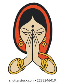 Indian woman in traditional dress pose to Namaste