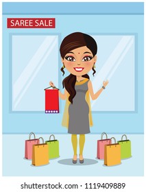 Indian Woman Wearing A Salwar Kameez Is Standing Next To Shopping Bags And Holding A Folded Saree In A Sale.