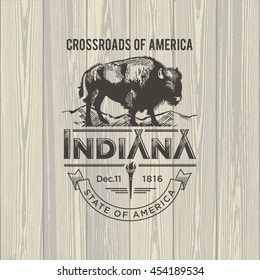 Indiana Crossroads of America, a stylized emblem of the state of America, Buffalo, on wooden background