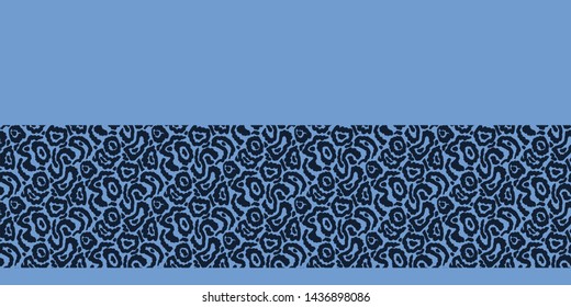 Indigo blue abstract stylized animal skin border pattern. Repeating texture background. Monochrome surface design textile edging. Zebra Giraffe camouflage fashion fabric ribbon trim. Seamless vector