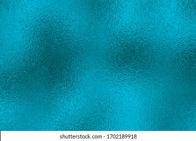 Indigo metallic effect. Blue texture shine foil. Turquoise abstract background with glitterer metal effect. Green surface. Backdrop glitter mint metal plate. Metallic texture foil for design prints