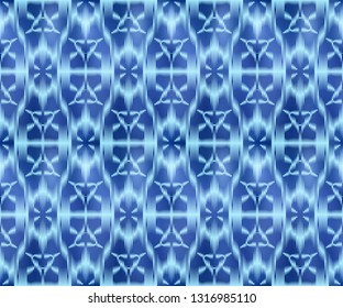 Indigo shibori dyed textile seamless pattern. Bohemian ikat ink background.