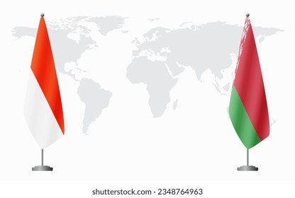 Indonesia and Belarusian flags for official meeting against background of world map.