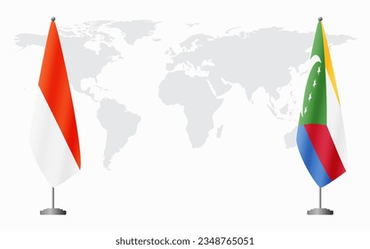 Indonesia and Comoros flags for official meeting against background of world map.