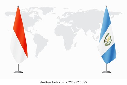 Indonesia and Guatemala flags for official meeting against background of world map.