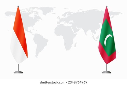 Indonesia and Maldives flags for official meeting against background of world map.