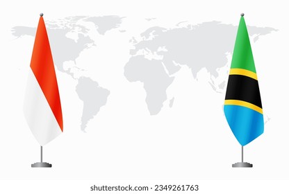 Indonesia and Tanzania flags for official meeting against background of world map.
