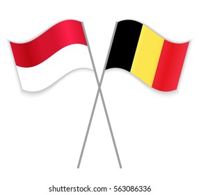 Indonesian and Belgian crossed flags. Indonesia combined with Belgium isolated on white. Language learning, international business or travel concept.