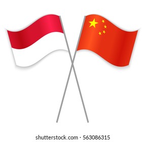 Indonesian and Chinese crossed flags. Indonesia combined with China isolated on white. Language learning, international business or travel concept.
