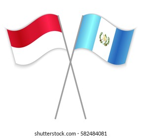 Indonesian and Guatemalan crossed flags. Indonesia combined with Guatemala isolated on white. Language learning, international business or travel concept.