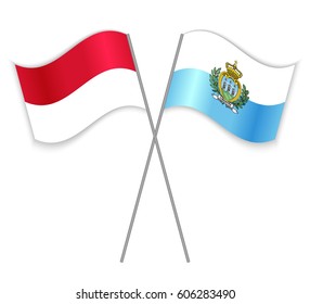 Indonesian and Sammarinese crossed flags. Indonesia combined with San Marino isolated on white. Language learning, international business or travel concept.