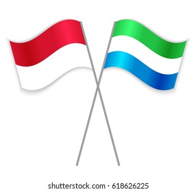 Indonesian and Sierra Leonean crossed flags. Indonesia combined with Sierra Leone isolated on white. Language learning, international business or travel concept.