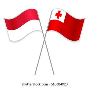 Indonesian and Tongan crossed flags. Indonesia combined with Tonga isolated on white. Language learning, international business or travel concept.