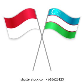 Indonesian and Uzbek crossed flags. Indonesia combined with Uzbekistan isolated on white. Language learning, international business or travel concept.